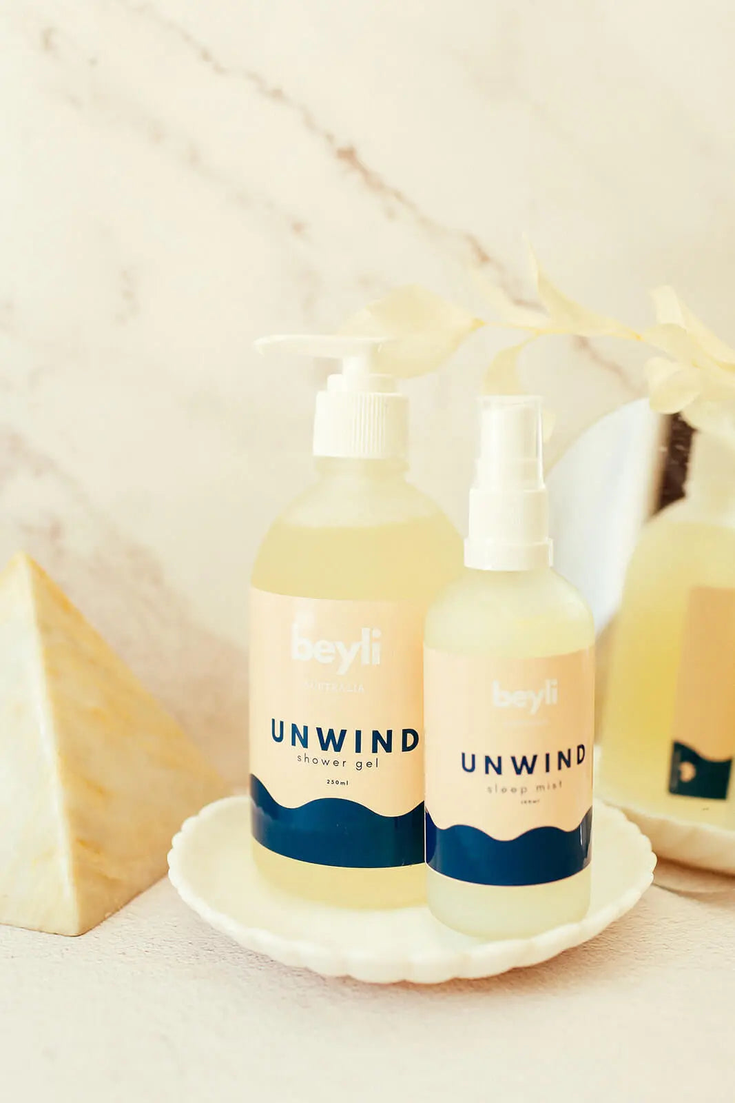 A collection of bedtime essentials with a sleep mist and a mask for relaxation